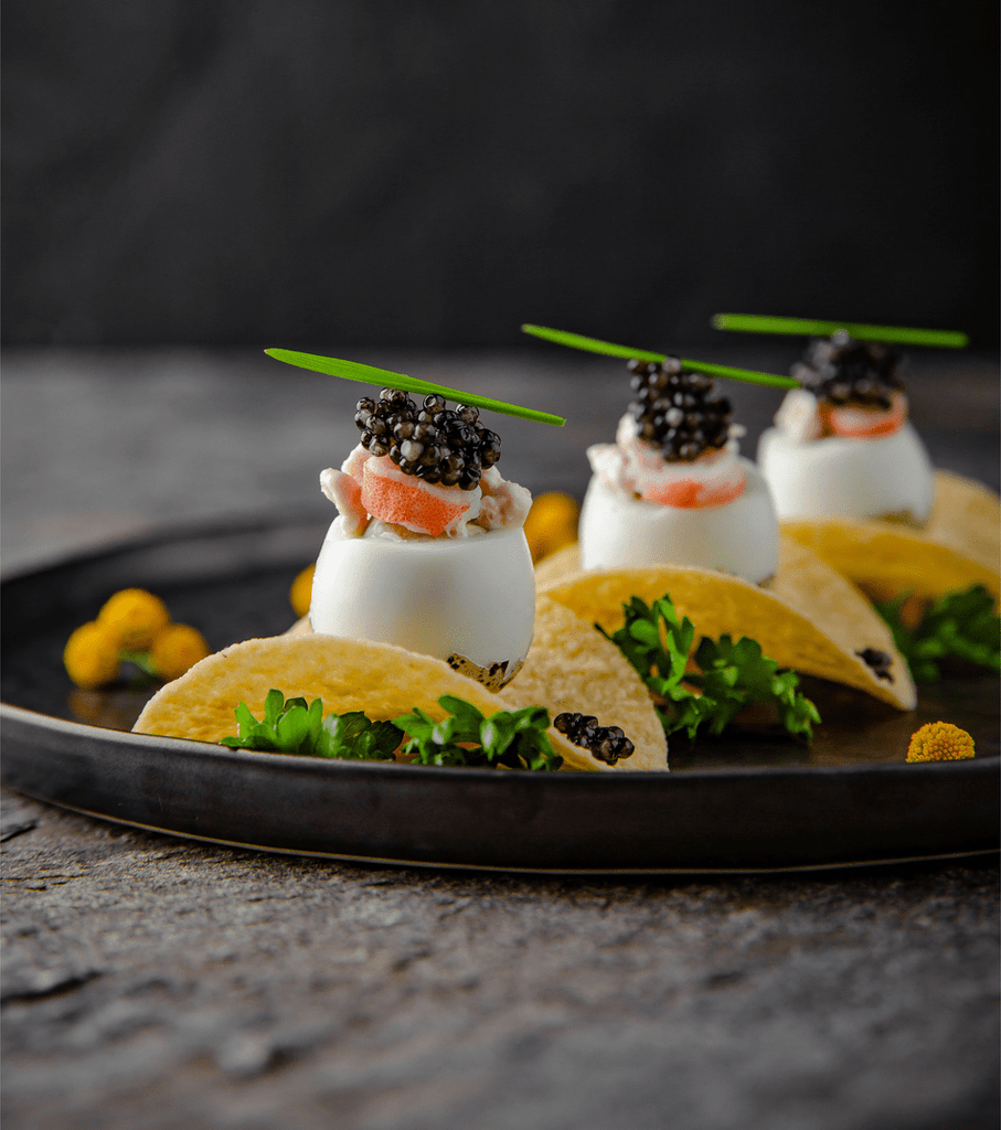 How can caviar be presented
