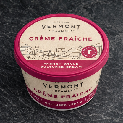 Container of Vermont Creamery Crème Fraçe on a dark surface